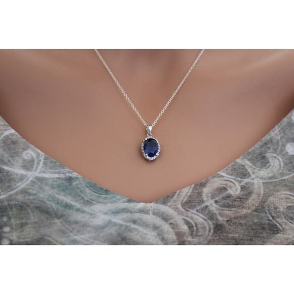 Sterling Silver Blue Oval CZ Pendant Circled in Clear CZ Stones Necklace - Picture 3 of 5